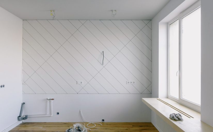 renovation in light room with wooden laminate